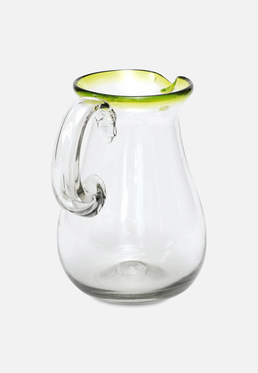 glass carafe with green rim from the back